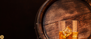 Bourbon central shop with a glass on top of a barrel